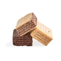 pile of assorted square wafer biscuits isolated on white