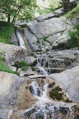 Fototapeta na wymiar Water flowing through the rocks