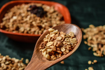 wooden spoon with granola and cereal
