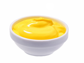 Сheese sauce in ceramic bowl isolated on white background