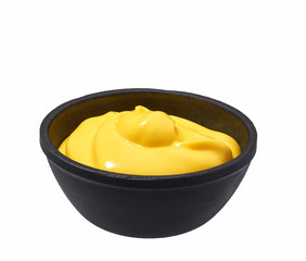 Сheese sauce  in  black bowl isolated on white background