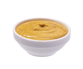 Mustard sauce in ceramic bowl isolated on white
