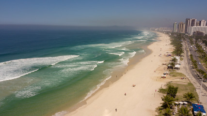 aerial view of a beach with green clean water and clean 