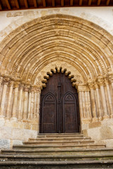 Fototapeta premium Entrance door of the Church of San Pedro de la Rua, Saint Peter's Church in Estella or Lizzara, Navarre Spain