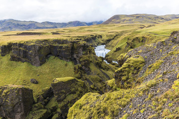 Fototapeta na wymiar Landscape above Skogafoss waterfall, moss, scenic, Iceland