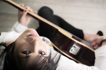 Beautiful And Sexy Woman with Acoustic Guitar