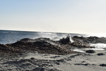 waves breaking on the rocks