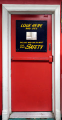 Vintage Safety First industrial door with mirror gimmick.