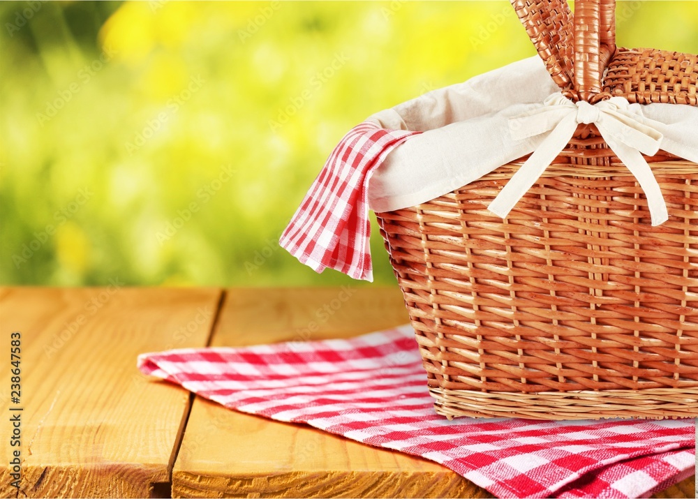 Poster Picnic Basket with napkin om nature background