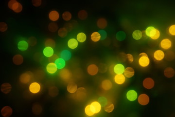 natural bokeh holiday lights background bright lights green yellow