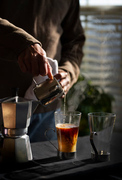 Midsection of man preparing coffee