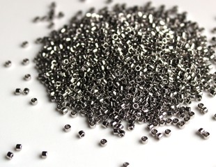pile of black sesame seeds isolated on white background