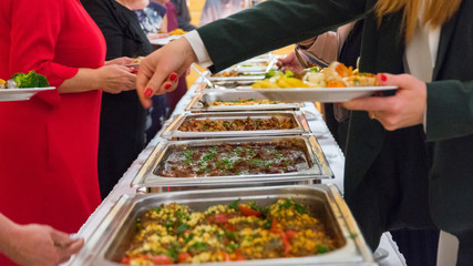 people group catering buffet food indoor in luxury restaurant with meat.
