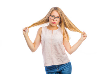 sexy young blond woman in glasses with a smile on her face holds her hair with both hands with her hands apart, woman's emotions, shooting on an isolated background