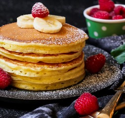 Close up of homemade fluffy pancakes stack, selective focus