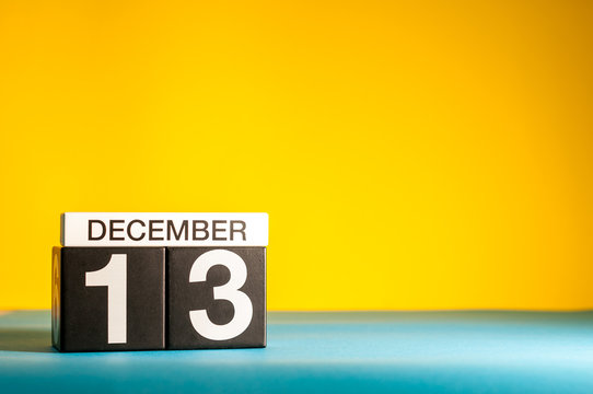 December 13th. Image 13 day of december month, calendar on yellow background with empty space for text