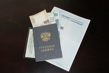 Labor document, money and medical card.