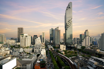 Bangkok Transportation before sunset with Modern Business Building from top view in Bangkok, Thailand.