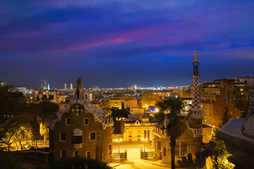 Fototapeta na wymiar Park Guell in Barcelona, Spain at night. Barcelona skyline..