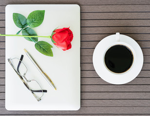 Coffee time with laptop,coffee cup,red rose