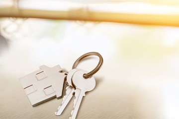 House shaped keychain and keys isolated on white background