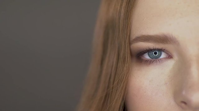 Cute young model poses for the camera. eyes close up