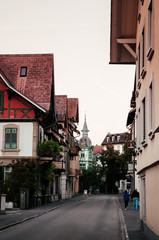 Fototapeta na wymiar Evening street scene and old buildings in old town Interlaken, Switzerland