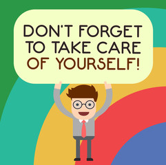 Naklejka premium Handwriting text writing Don T Forget To Take Care Of Yourself. Concept meaning Be aware of your demonstratingal health Man Standing Holding Above his Head Blank Rectangular Colored Board