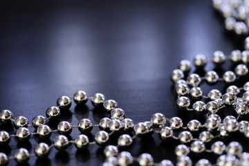 Silver Christmas decoration on a dark background close up