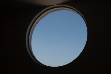 black circle window and blue sky