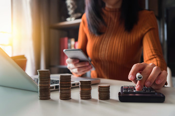 Business women are calculating daily expenses.