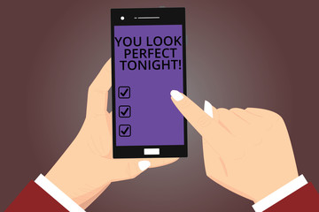 Conceptual hand writing showing You Look Perfect Tonight. Business photo showcasing Flirting beauty appreciation roanalysistic feelings Hu analysis Hands Holding Pointing Smartphone Color Screen