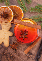 Mulled wine and gingerbread for Christmas with spices and spruce branches