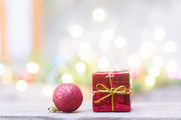 Close up of red ball and red gift box for Christmas or New Year decoration background