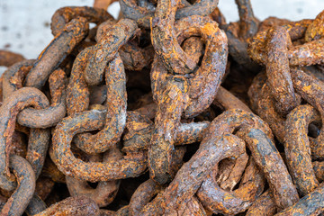 Rusty chains eroded by sea water