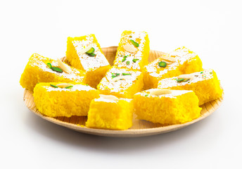 Indian Popular Sweet Food Khopara Pak or Coconut Burfi made up of Coconut, Milk And Sugar Isolated on White Background