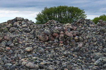 Stone mounds - artificial stone mounds of small boulders on the Bolshoy Zayatsky Island. Solovetsky archipelago, White sea, Russia