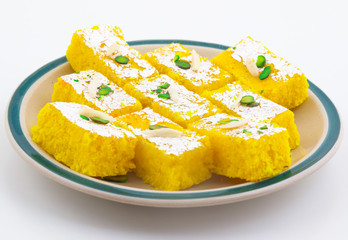 Indian Popular Sweet Food Khopara Pak or Coconut Burfi made up of Coconut, Milk And Sugar Isolated on White Background