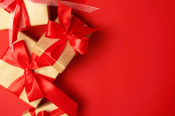Wrapped presents with bright red background with copy space