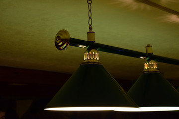 Green billiard lamp close up.