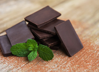 Chocolate and cocoa powder  on a old wooden table