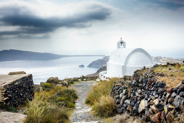 Fototapeta na wymiar Scenic view of sea and mountain with Orthodox Church; Santorini island; Greece