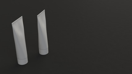 Pair of blank white tubes of toothpaste, cream or gel