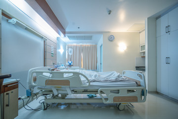 hospital recovery patient single room with fully furnished with a female patient with saline unit on bed
