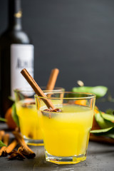 Old fashioned citrus beverage with spices. Selective focus. Shallow depth of field.