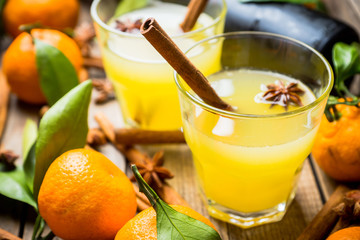 Old fashioned citrus beverage with spices. Selective focus. Shallow depth of field.