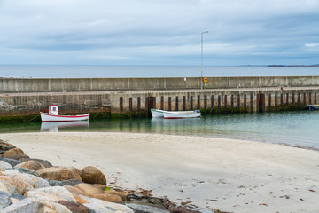boats at the pier on the beach