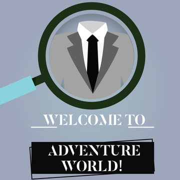 Writing note showing Welcome To Adventure World. Business photo showcasing Enjoyment travelling exploring new places Tourism Magnifying Glass Enlarging a Tuxedo and Label Tag Below