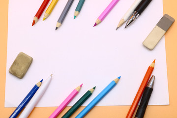 colored pencils and a clean sheet of paper