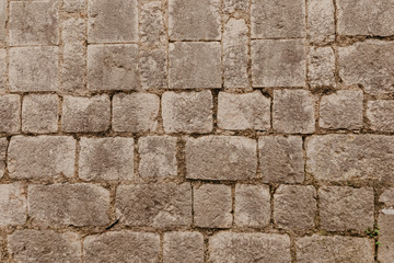 Texture of a stone wall. Old castle stone wall texture background. Stone wall as a background or texture. Part of a stone wall, for background.